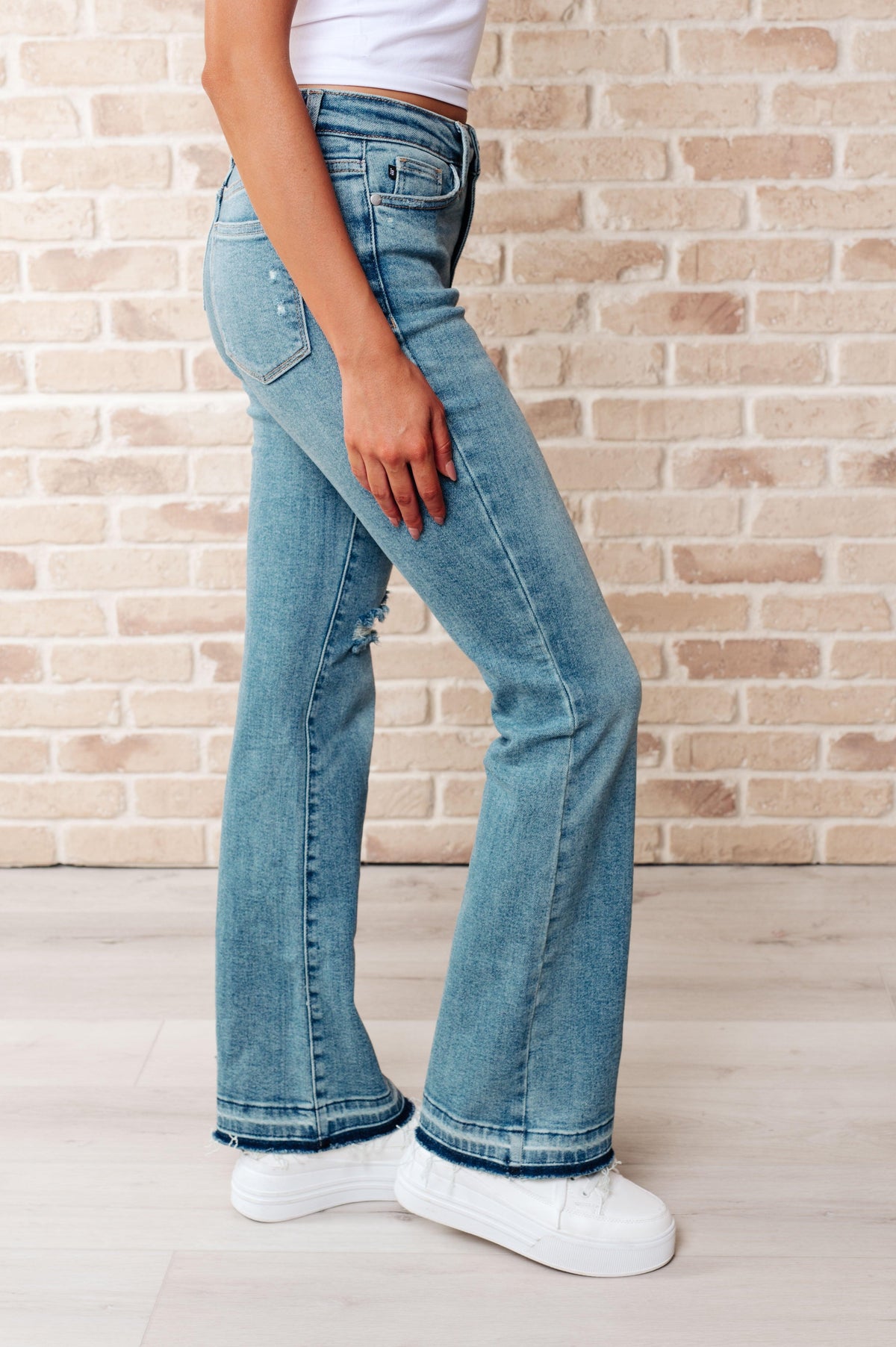 Judy Blue | Isla Mid Rise Distressed Released Hem Bootcut Jeans - becauseofadi